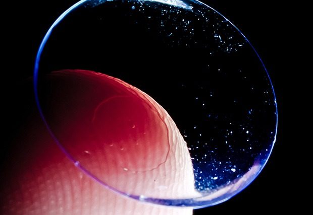 Closeup shot of contact lens on the tip of a finger