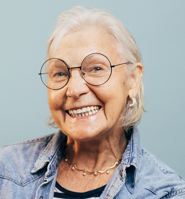 older woman round glasses