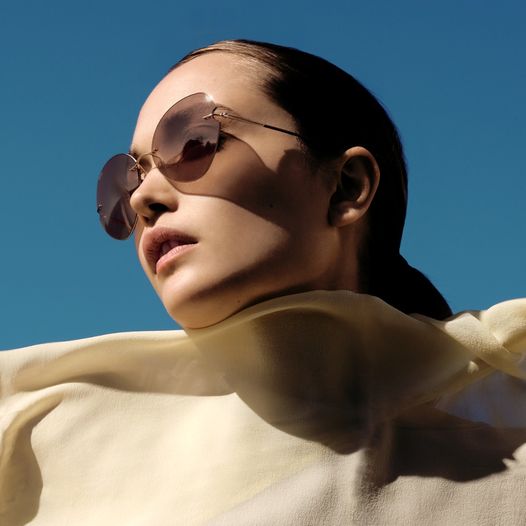 elegant woman wearing silhouette sunglasses