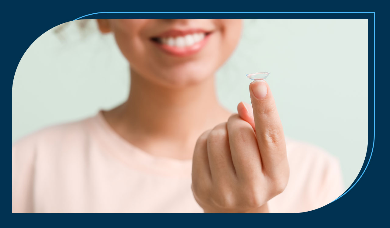 Female Holding Contact Lense