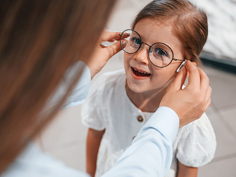 Young Girl Fitting Eyeglasses