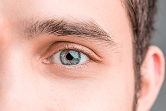 close up of a man wearing scleral lenses