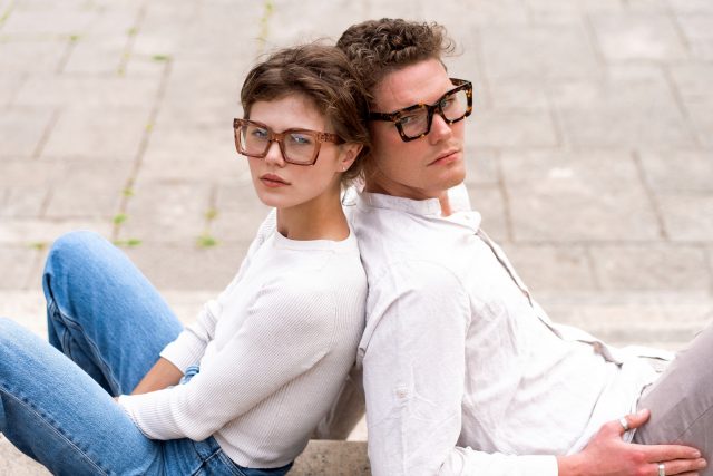 attractives man and woman wearing stylish glasses