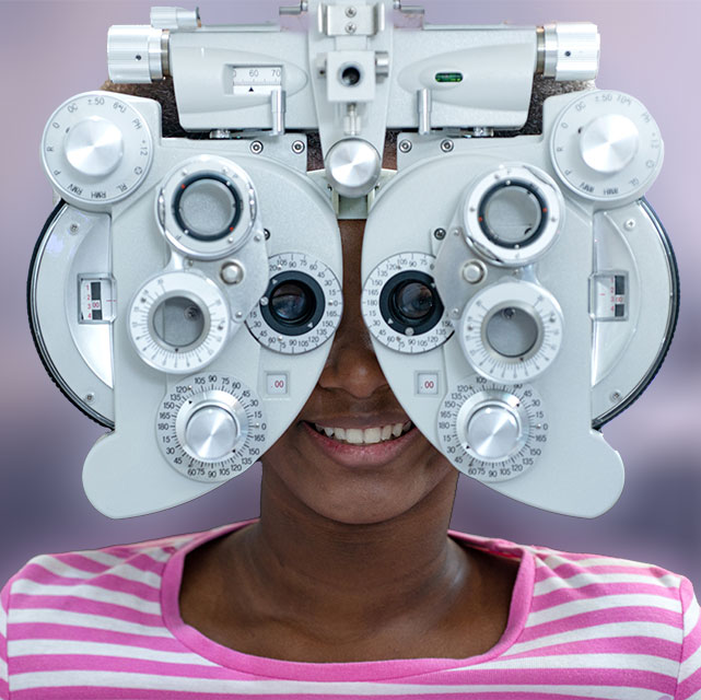girl receiving eye exam