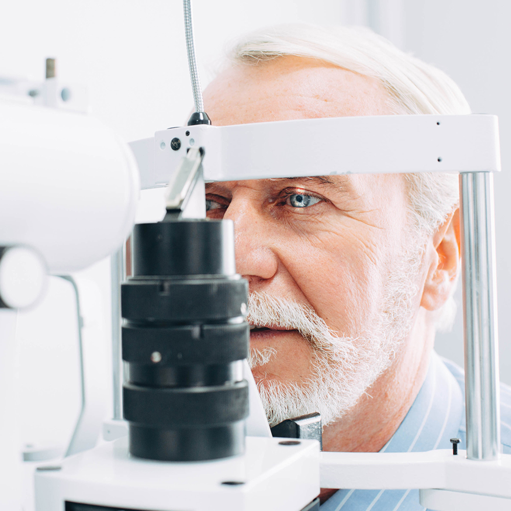 Older caucasian male eye examination
