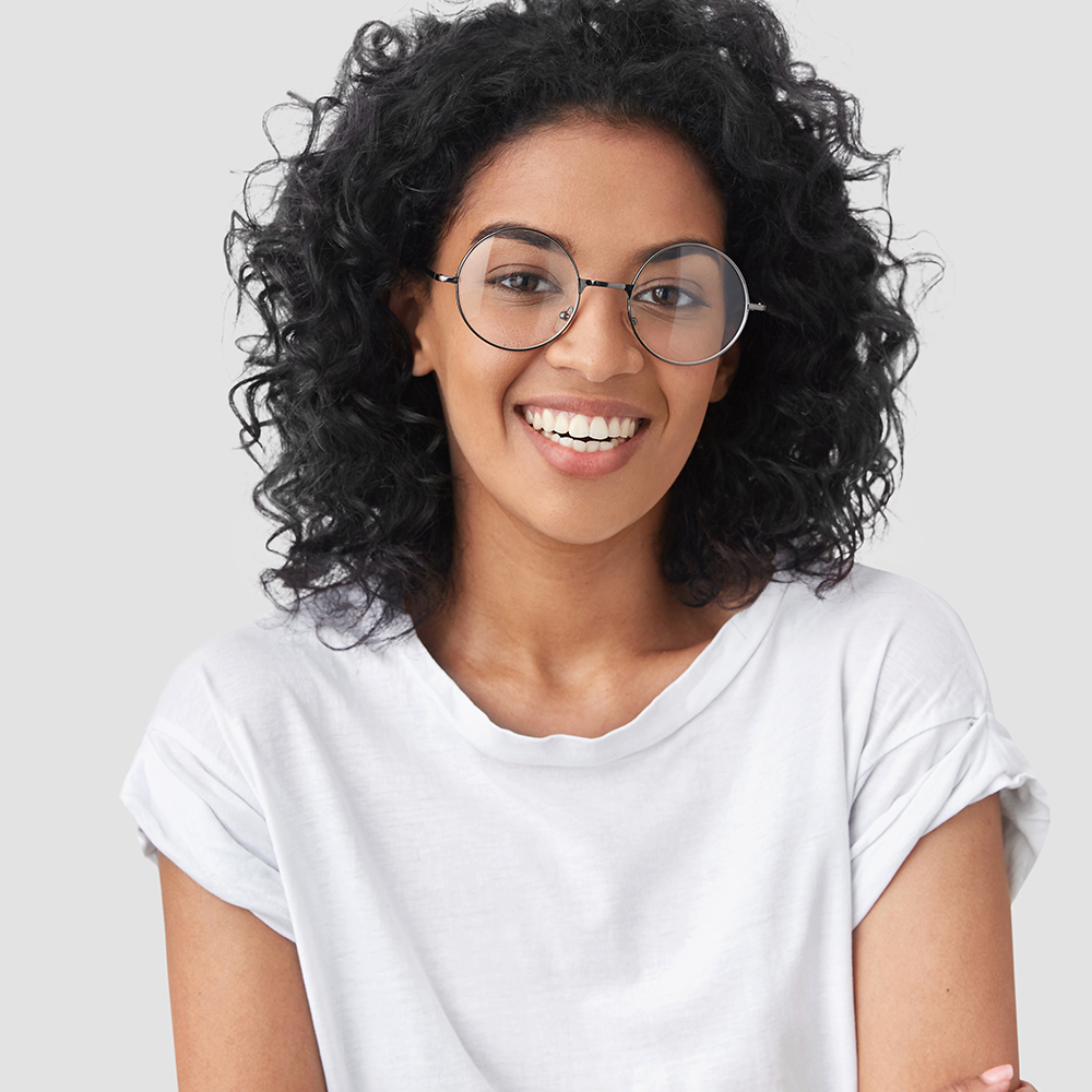 stylish young african american female smiling wearing designer frames