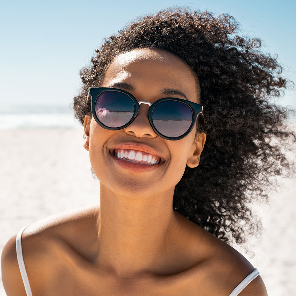 Female Smiling Wearing Sunglasses2