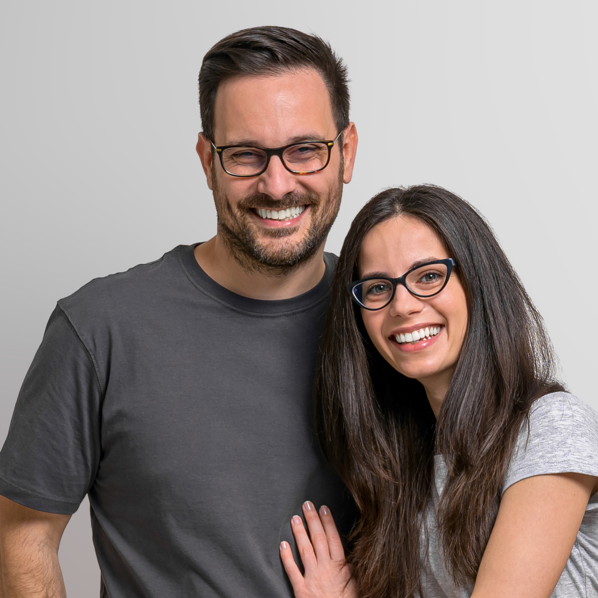 happy couple modeling eyeglasses