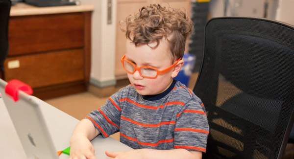 little boy doing vision therapy