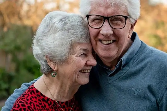 senior couple embracing outdoors
