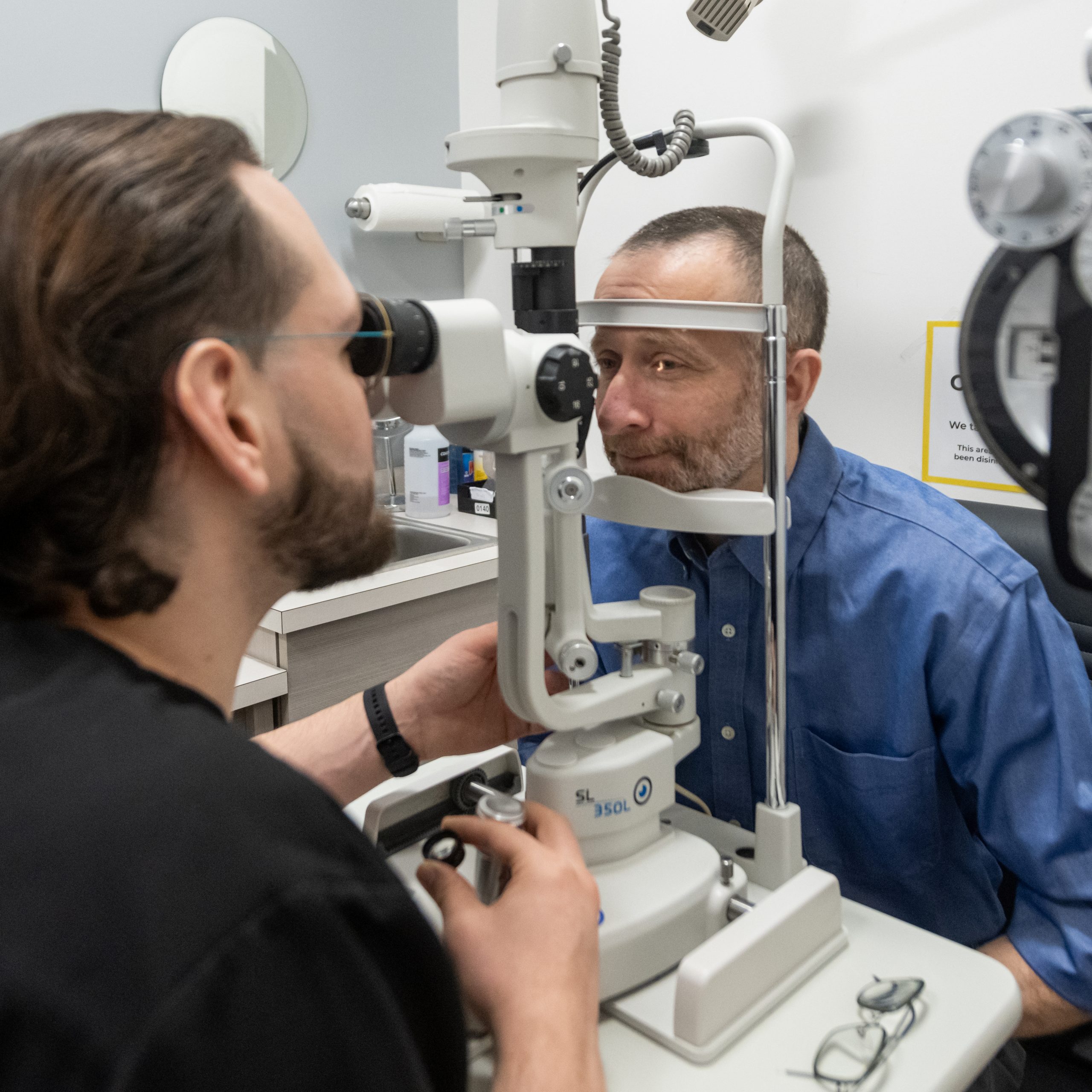 optometrist checking a patient cornea