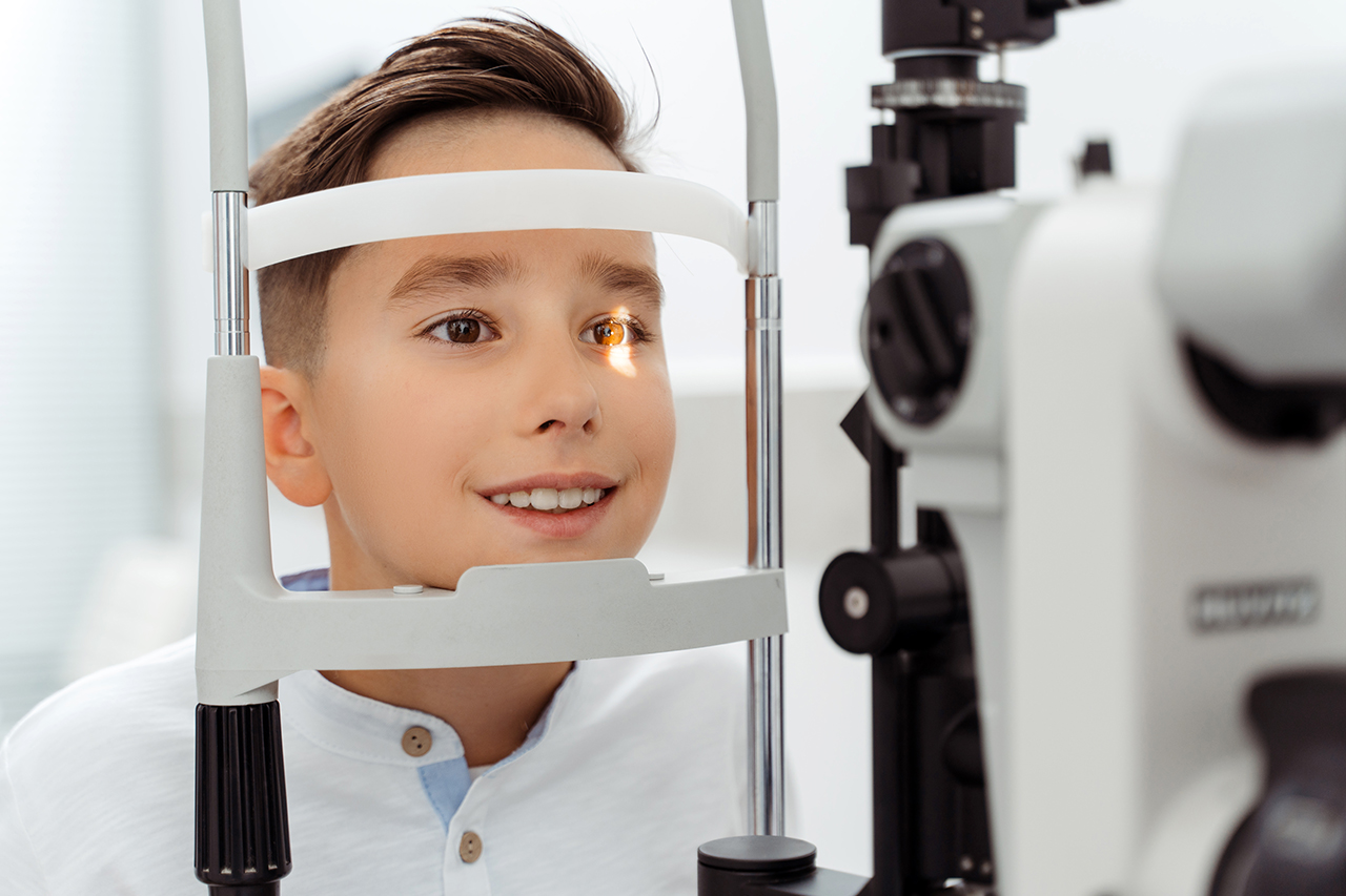 boy undergoing pediatric eye exam
