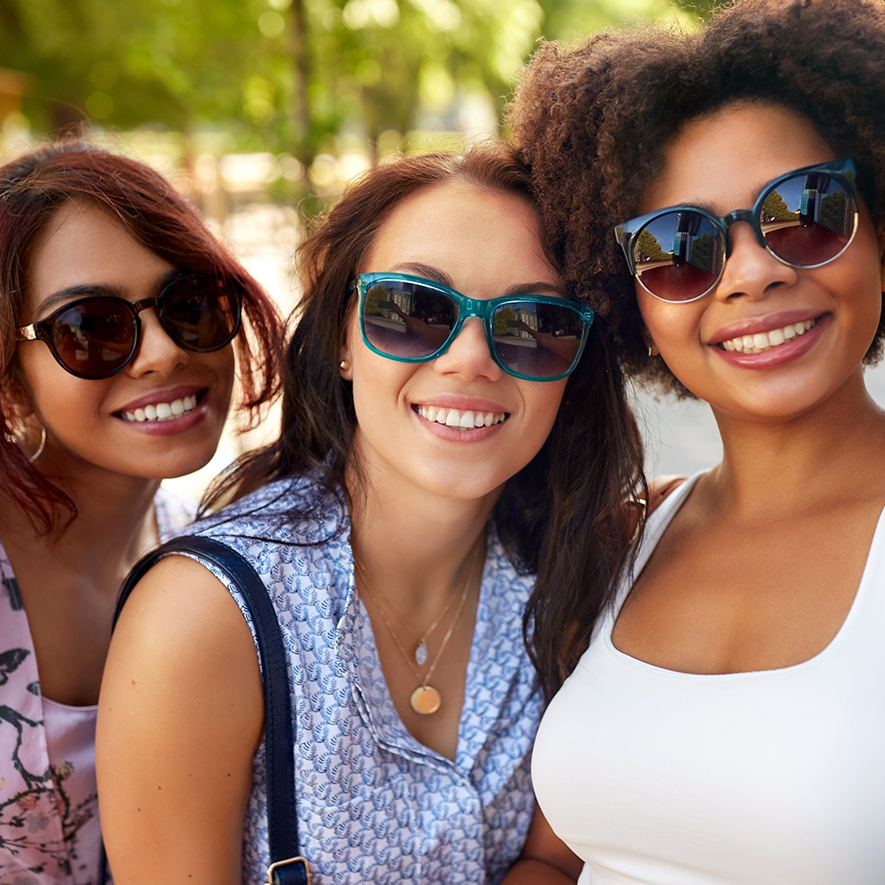 young group of friends wearing sunglasses