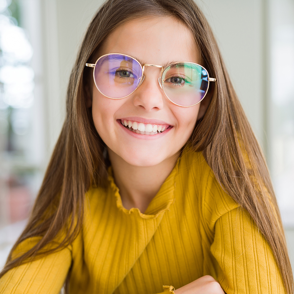 Smiling girl wearing eyeglasses