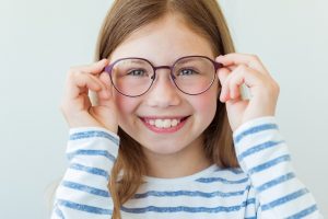 young girl modeling eyeglasses
