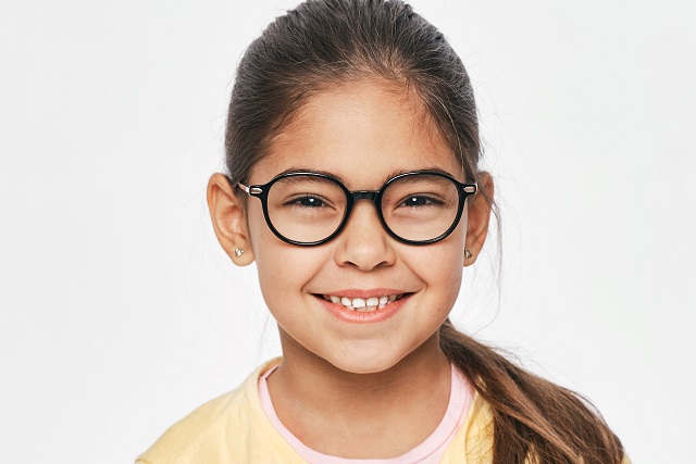 little girl modeling eyeglasses