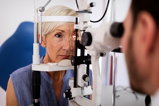 optometrist checking womans eye
