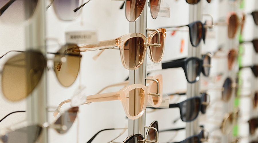 fashionable sunglasses on the shop shelf