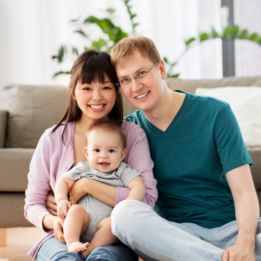happy parents with baby at home