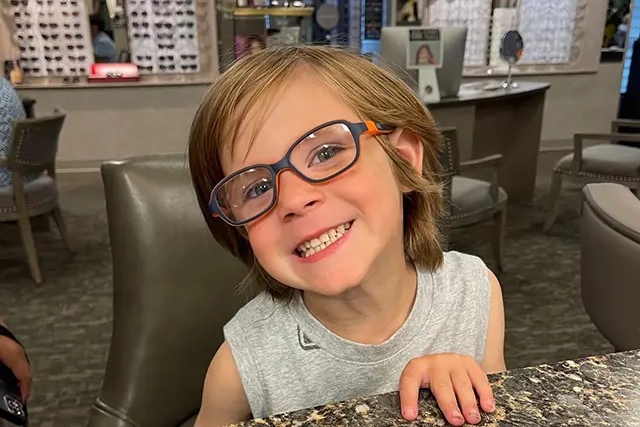 happy boy wearing eyeglasses