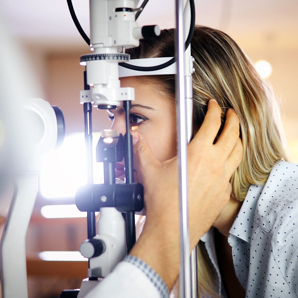 Optometrist examining patient in modern ophthalmology clinic