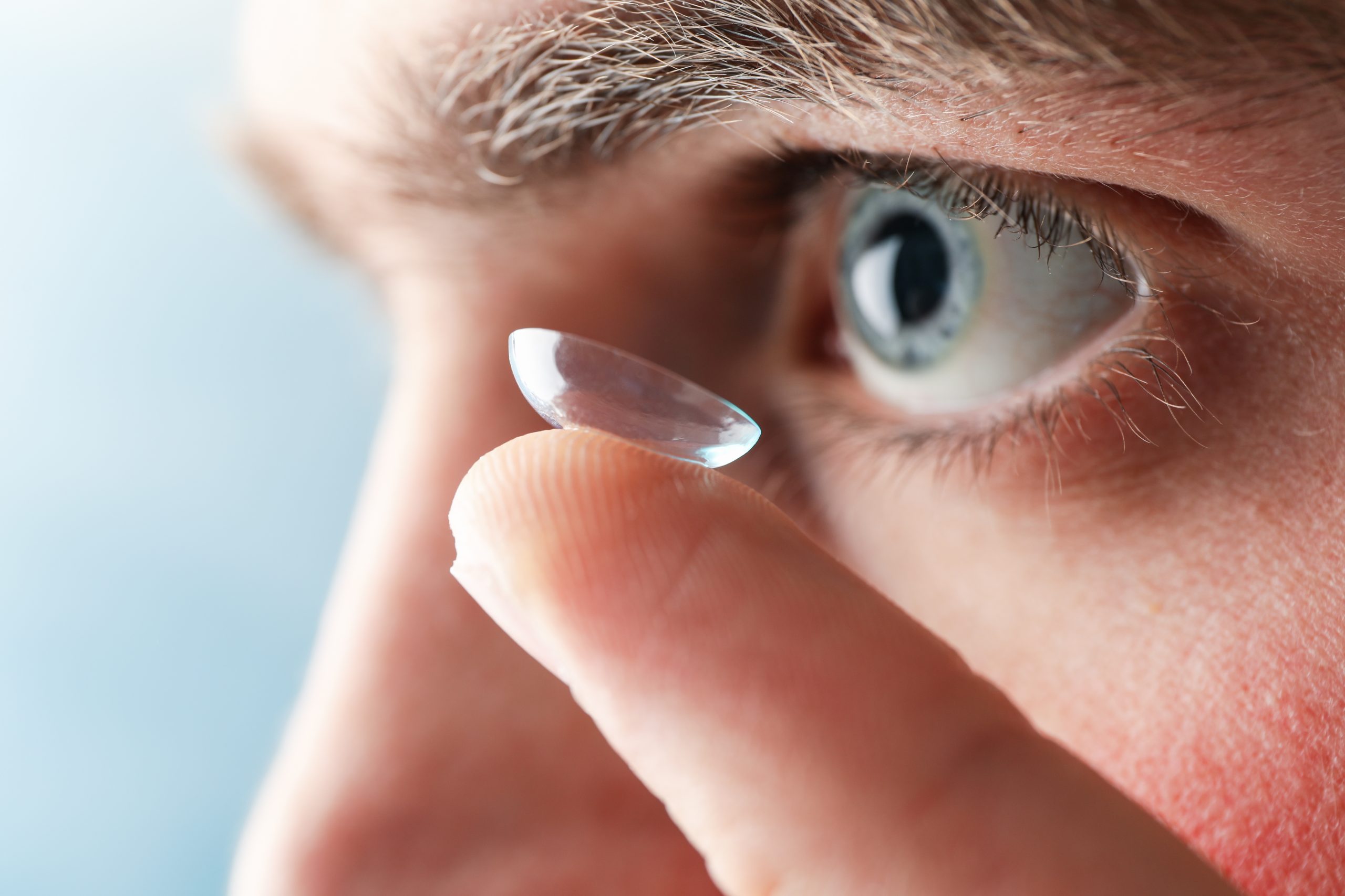 Inserting a corrective contact lens