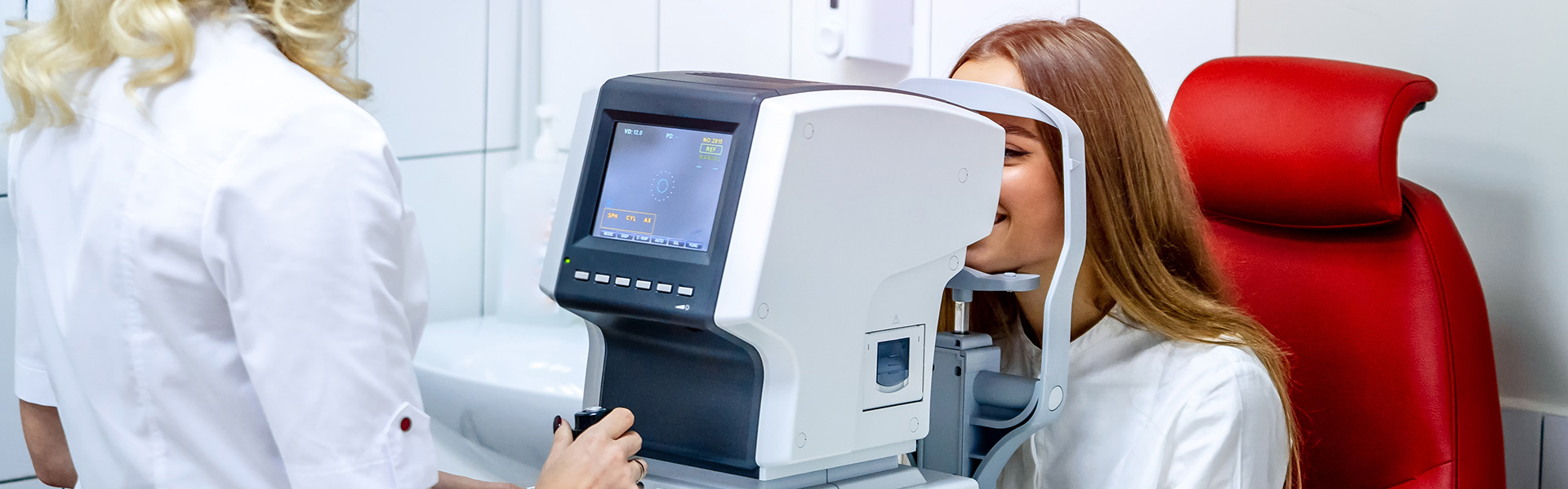 Young woman checking vision. Medical examination at the ophthalmological office