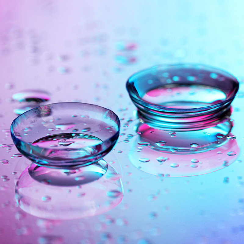 contact lenses, on pink blue background
