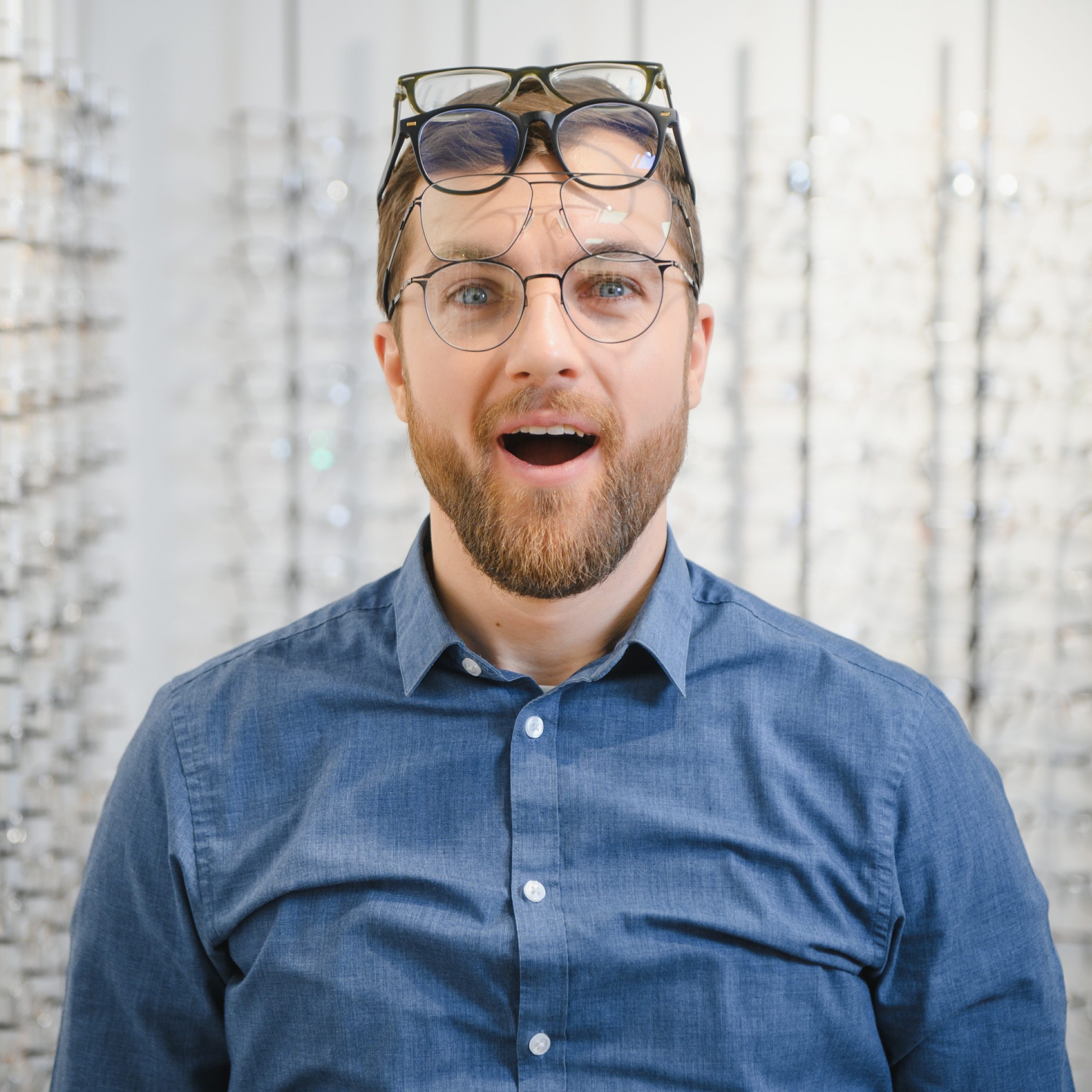 Man wearing multiple eyeglasses