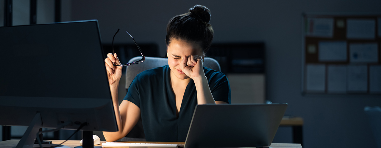 Woman With Dry Tired Eyes Working Late At Night