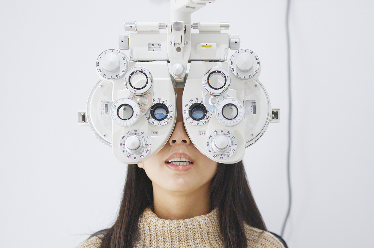 Woman doing eye test in clinic