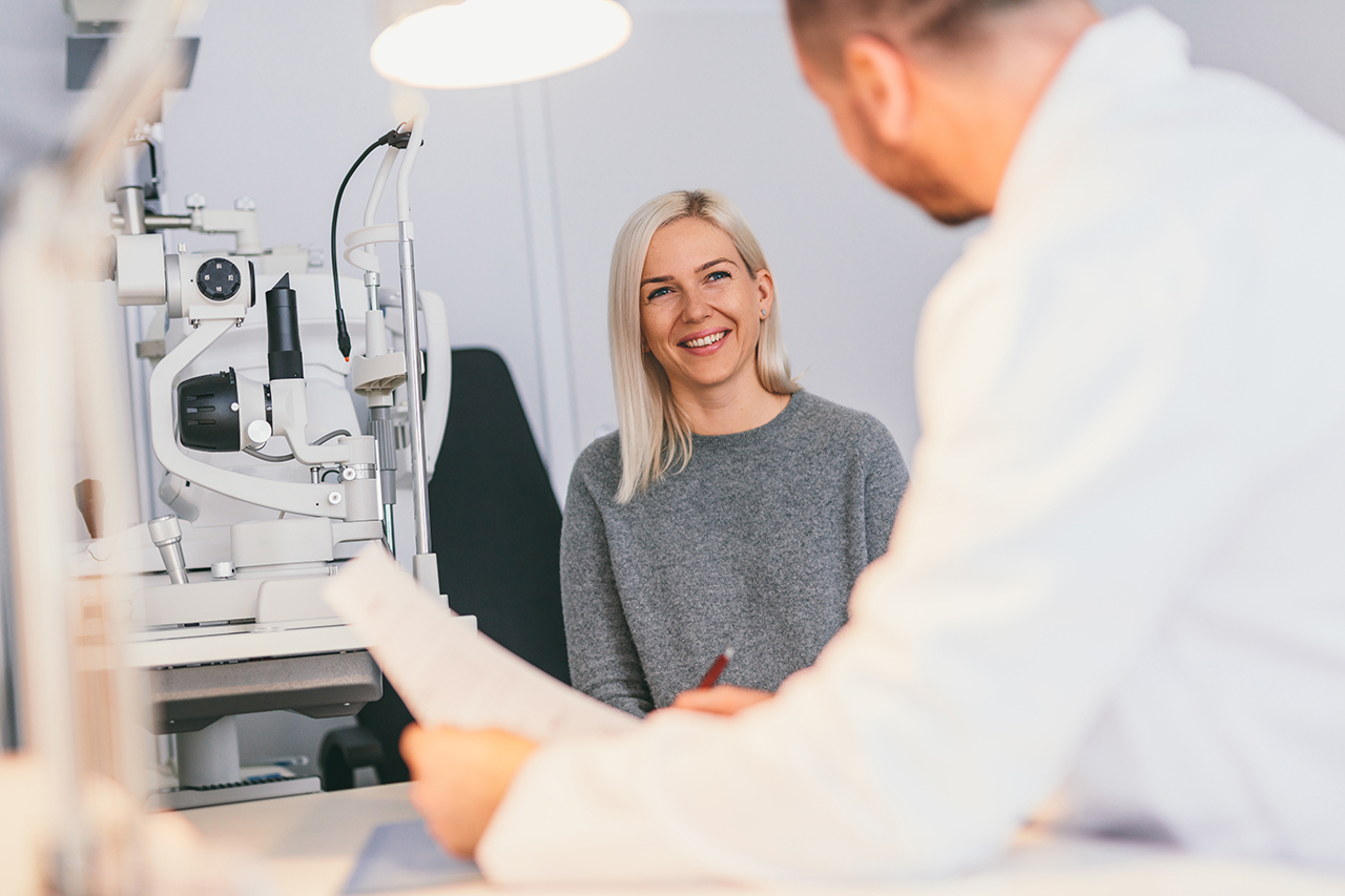 smiling woman with optometrist