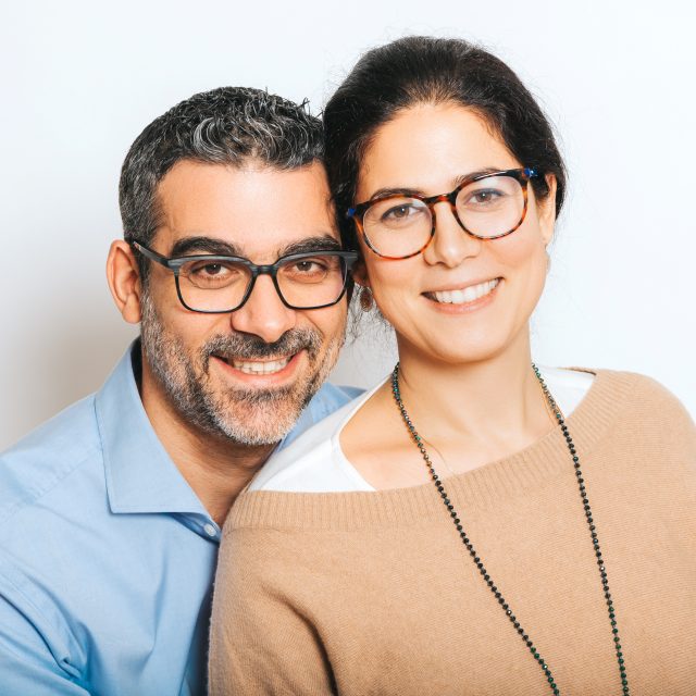 happy couple modeling eyeglasses