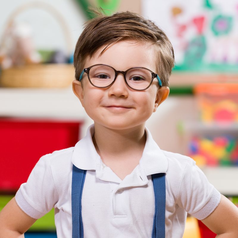 portrait of smiling little boy with eyeglasses