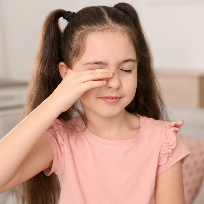 little girl rubbing eye 800x800