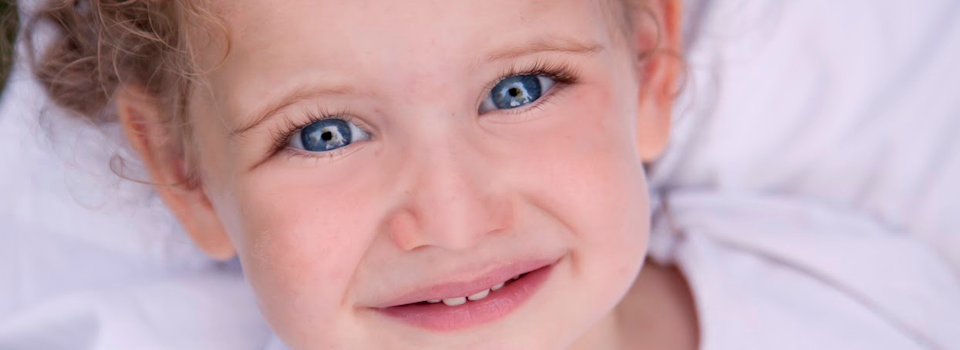 close-up-of-blue-eyed-toddler-slide.png