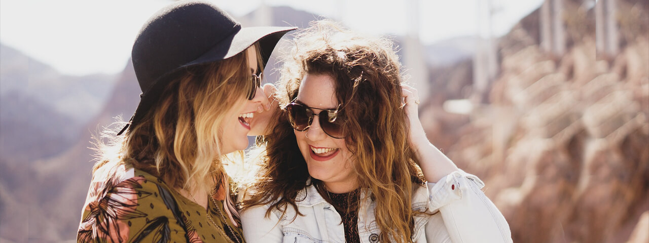 Two women wearing sunglasses
