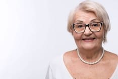 smiling older woman on eye disease ad