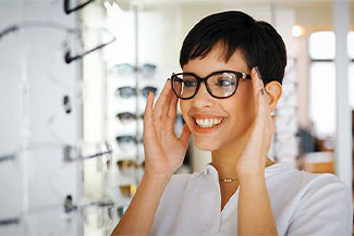 Woman Trying on Glasses Thumbnail