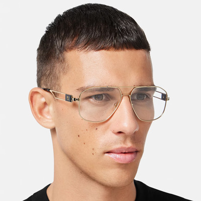 man wearing gold versace eyeglasses