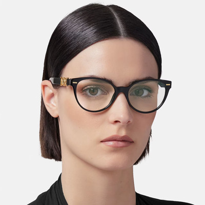 woman short hair wearing black versace eyeglasses