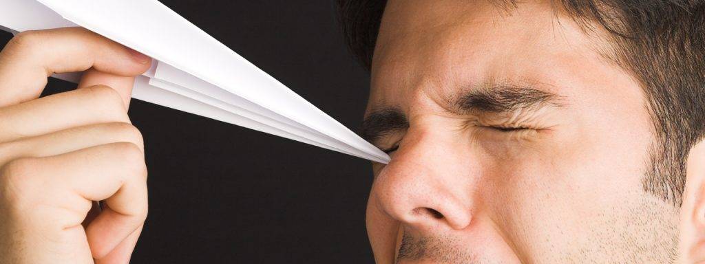 Man Poking Eye with Paper Airplane