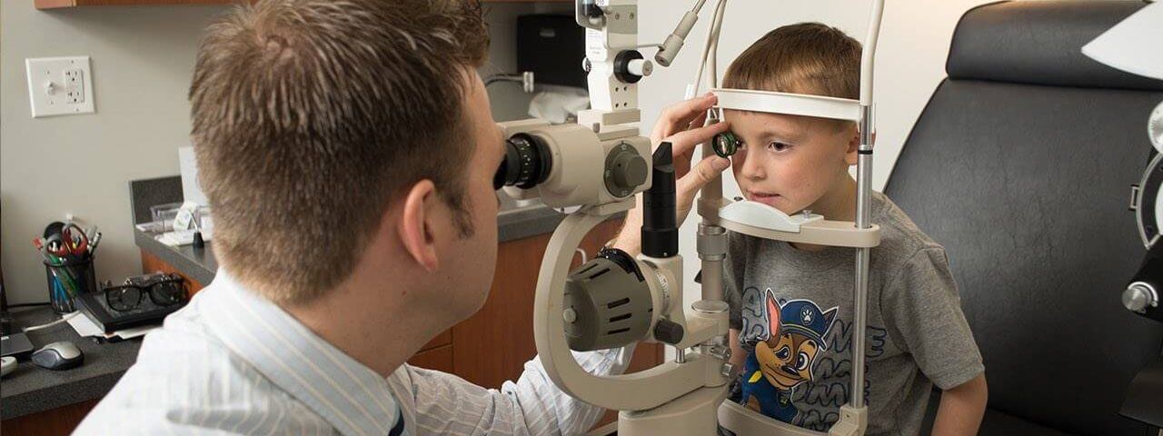 Optometrist, boy at an eye exam on San Francisco, CA