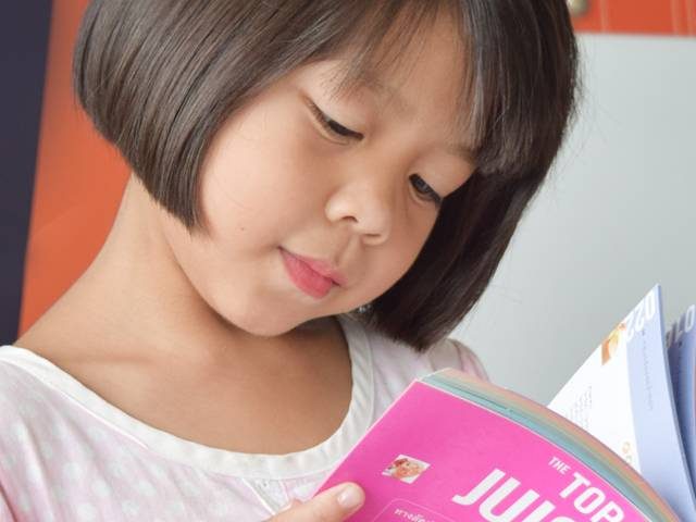Eye care girl reading book in Totowa, NJ