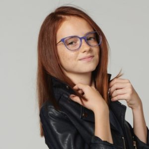 girl wearing blue rimmed nano eyeglasses