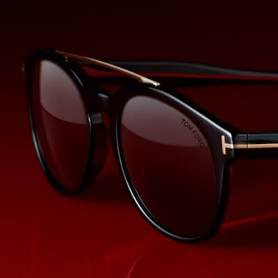 pair of tom ford sunglasses on dark background