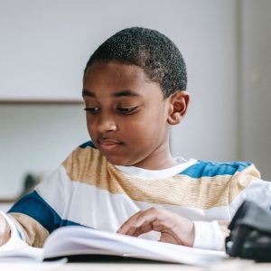 african american boy doing his homework