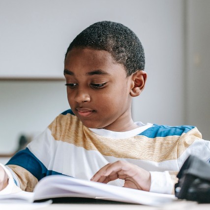 african american boy doing his homework