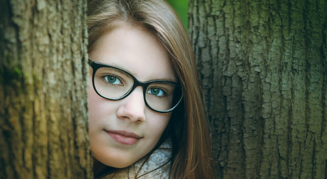 girl stand with tree wearing glasses optometrist near me.Johnstown, OH 640×350