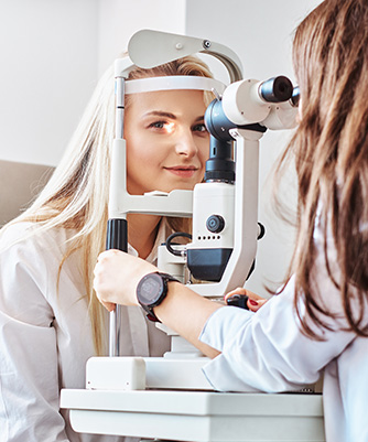 Attractive woman is doing eye test in optical clinic with experienced oculist.